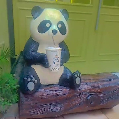 Panda On Wooden Log