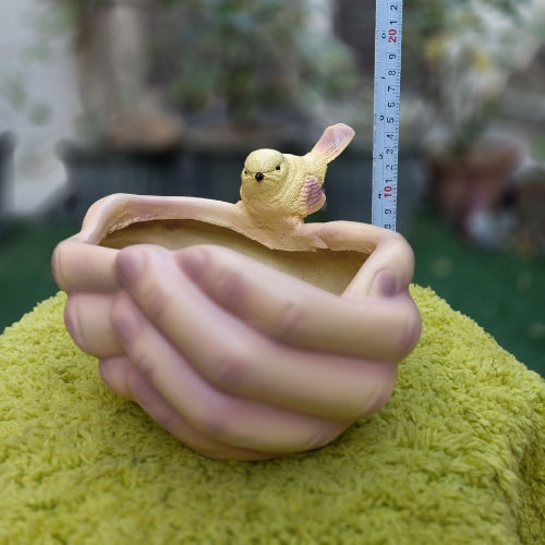 Bird on hand planter