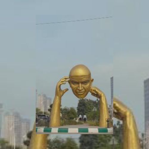 Face In Hand Sculpture