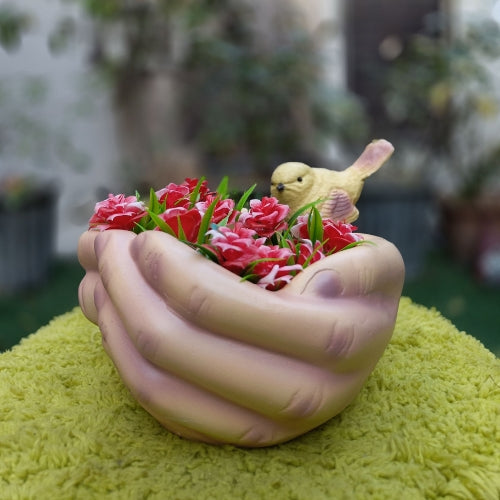 Bird on hand planter
